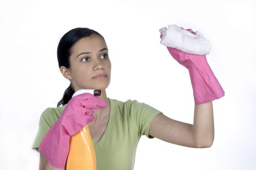 Cleaning staff observing safe handling practices with products and equipment